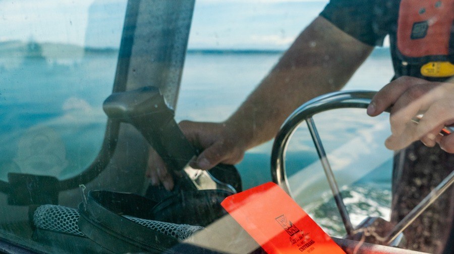 Rite in the Rain notebook in the windsheild of a fishing vessel.