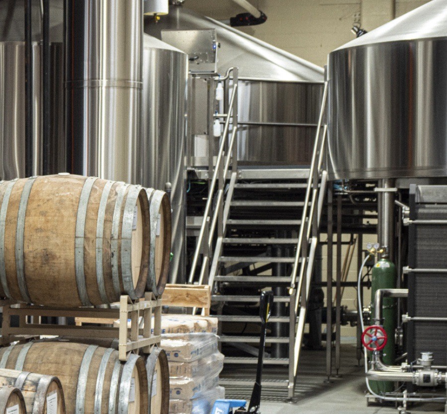 Stainless steel holding tanks and barrels.
