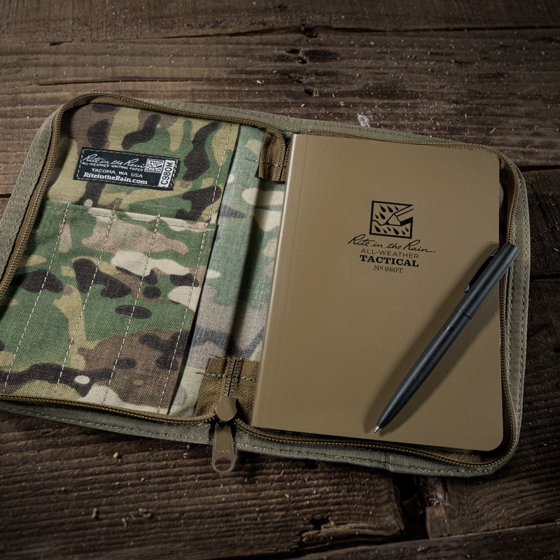 Multicam book cover open iwth tactiacl field book and all weather pen. 