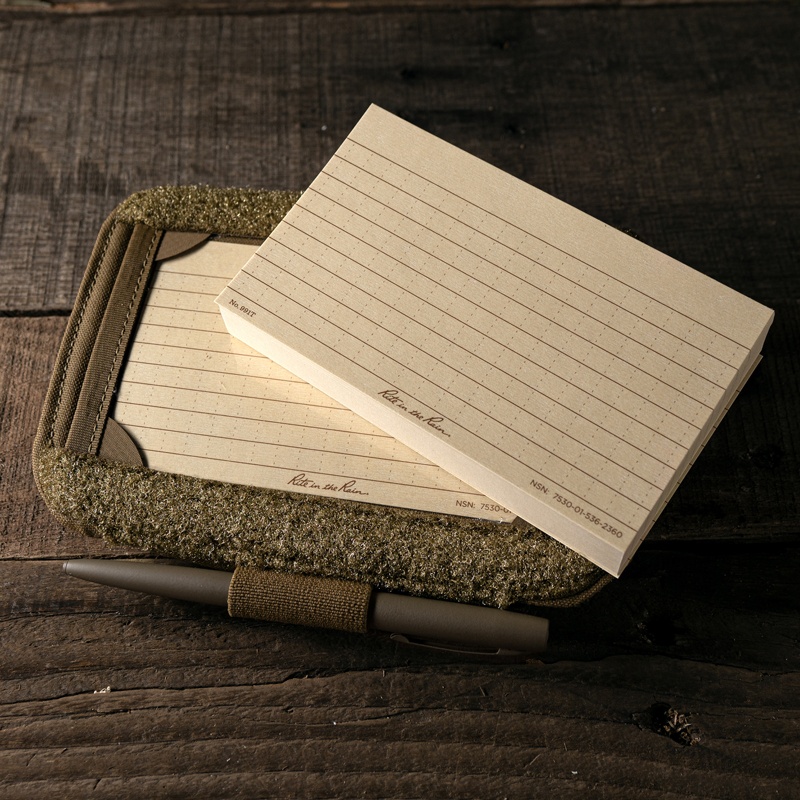 Stack of index cards resting on the arm band with pen in loop.