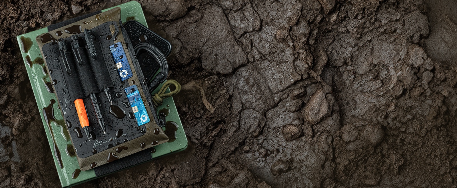 Open Pocket pouch with a notebook that says protect and organize your essential field tools.