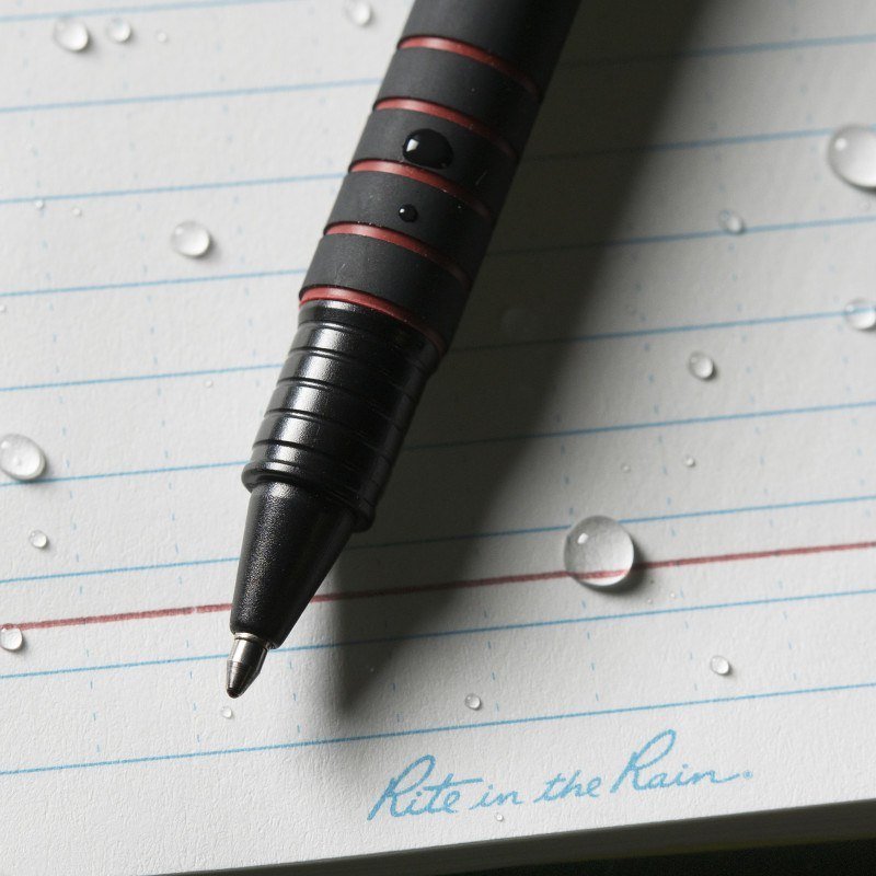 Durable clicker pen on wet paper, ink writing through water.