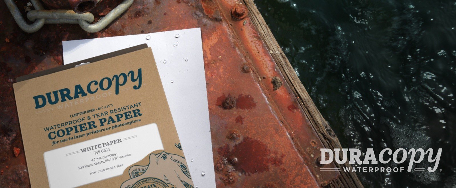 Soaked DuraCopy waterproof paper on industrial dock.
