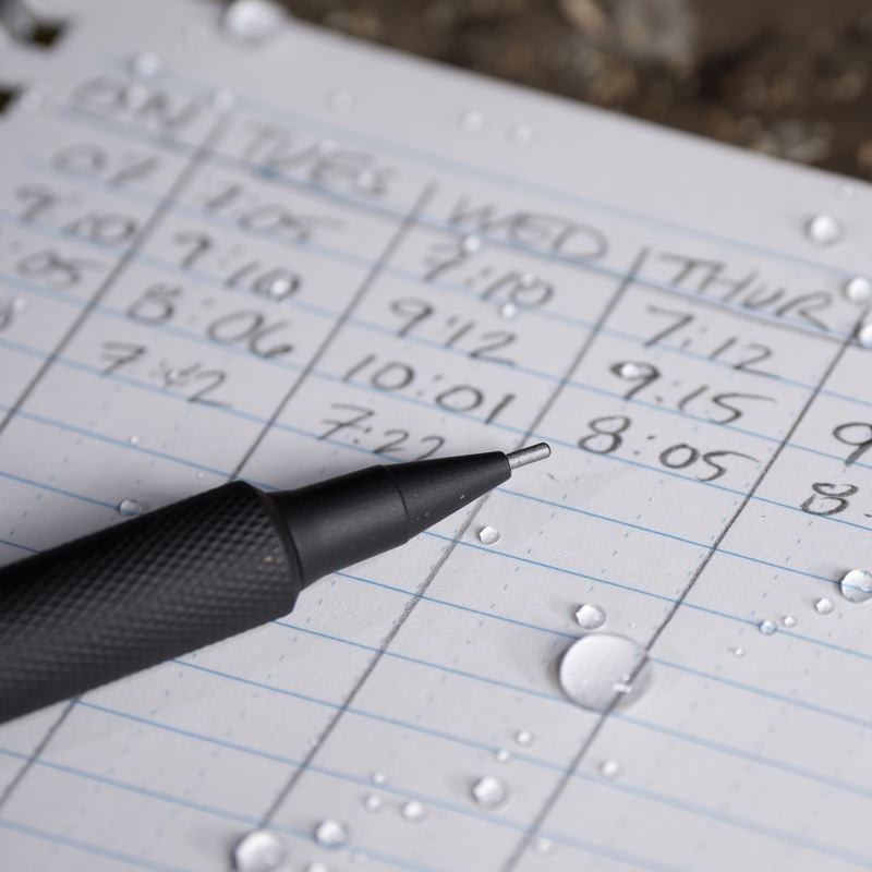 pencil sitting on paper with handwritten chart