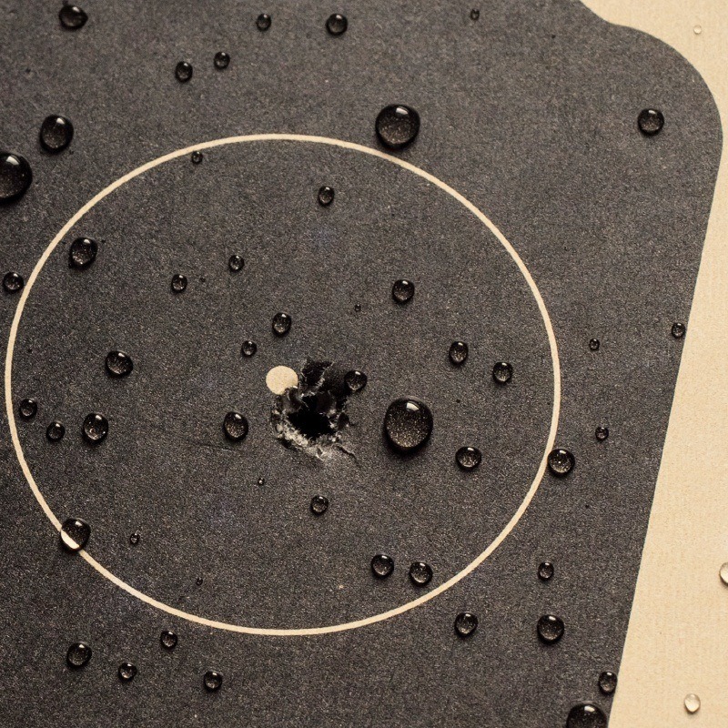 Bullet hole through wet target.
