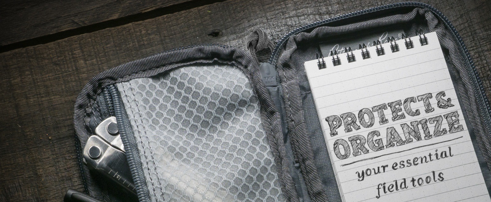 Open Pocket pouch with a notebook that says protect and organize your essential field tools.