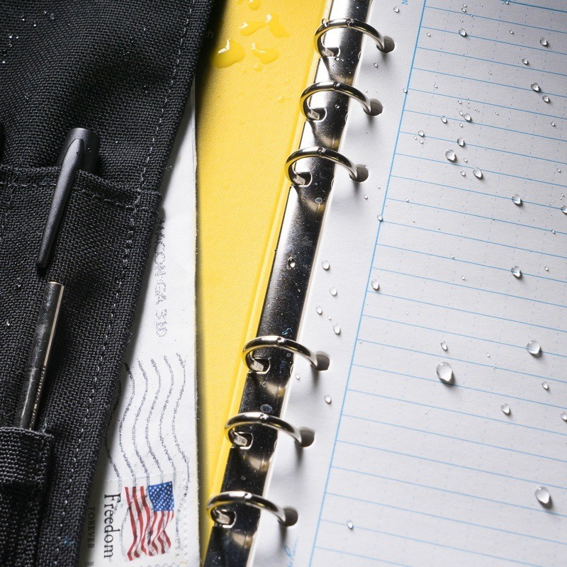 Ring binder cover containing ring binder and wet loose leaf