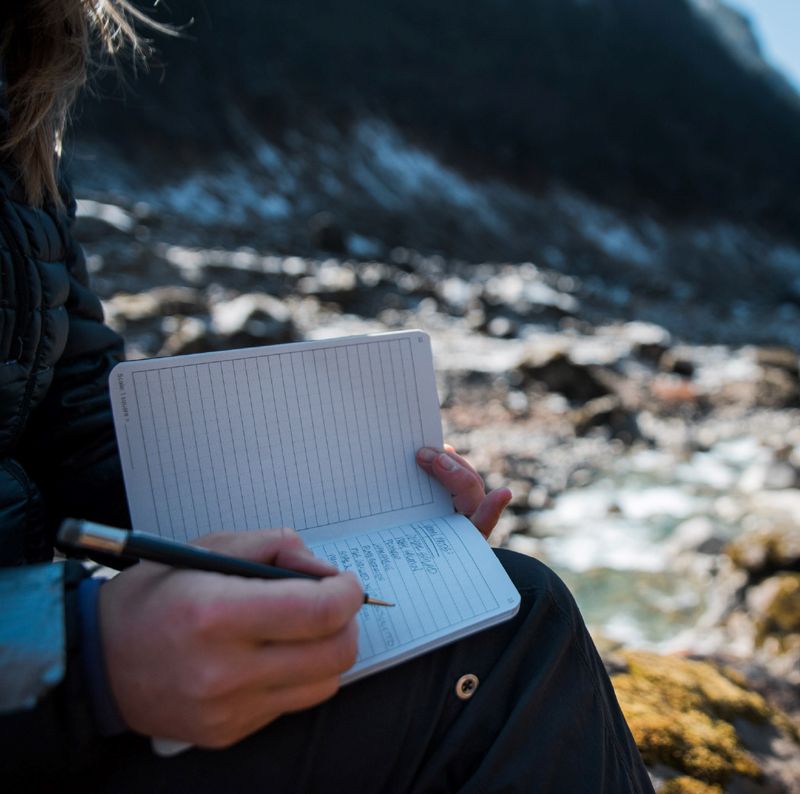 Mountaineer journaling.