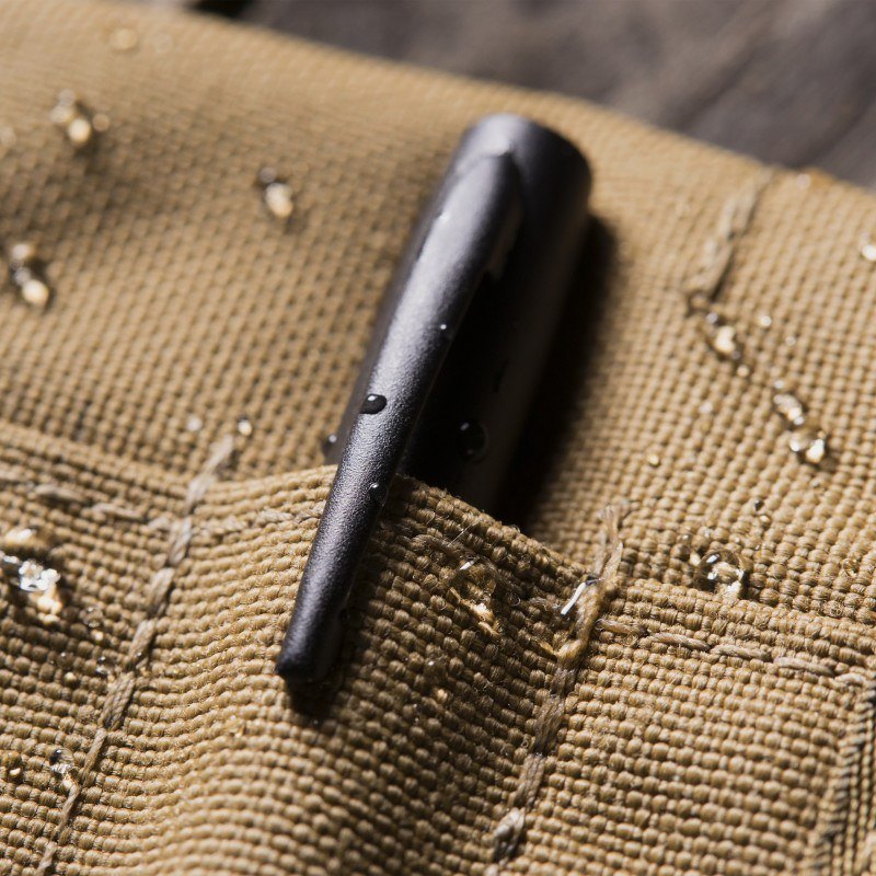 Close up of all weather pen peaking out of instrument pocket.
