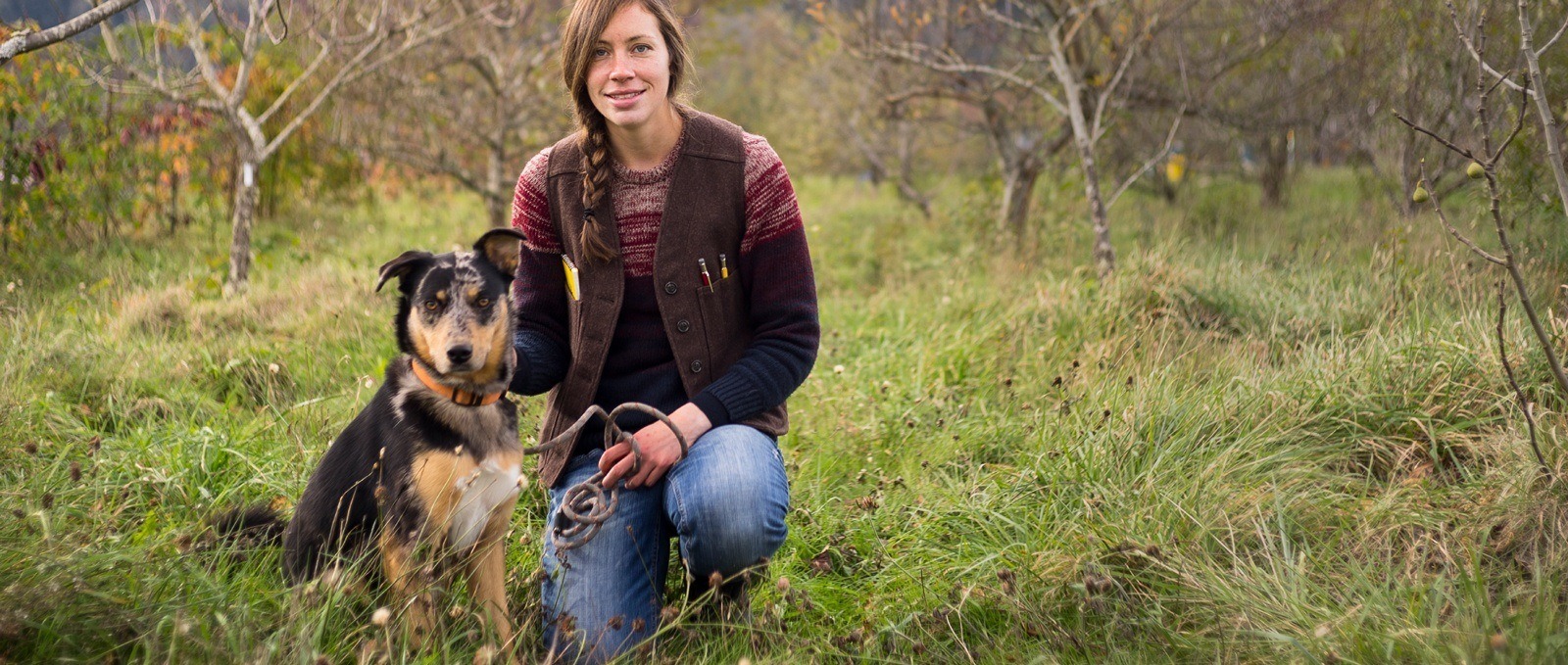 farmer with dog, notebook in pocket